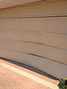Damaged sectional door panels